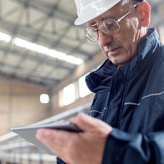 quality-worker-using-tablet-525x525