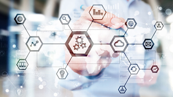 Person pointing at a diagram of connected icons